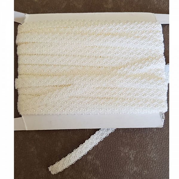 Av meteren Fancy hvit elastisk 11 mm.