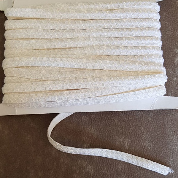 Av meteren Fancy hvit elastisk 10 mm.