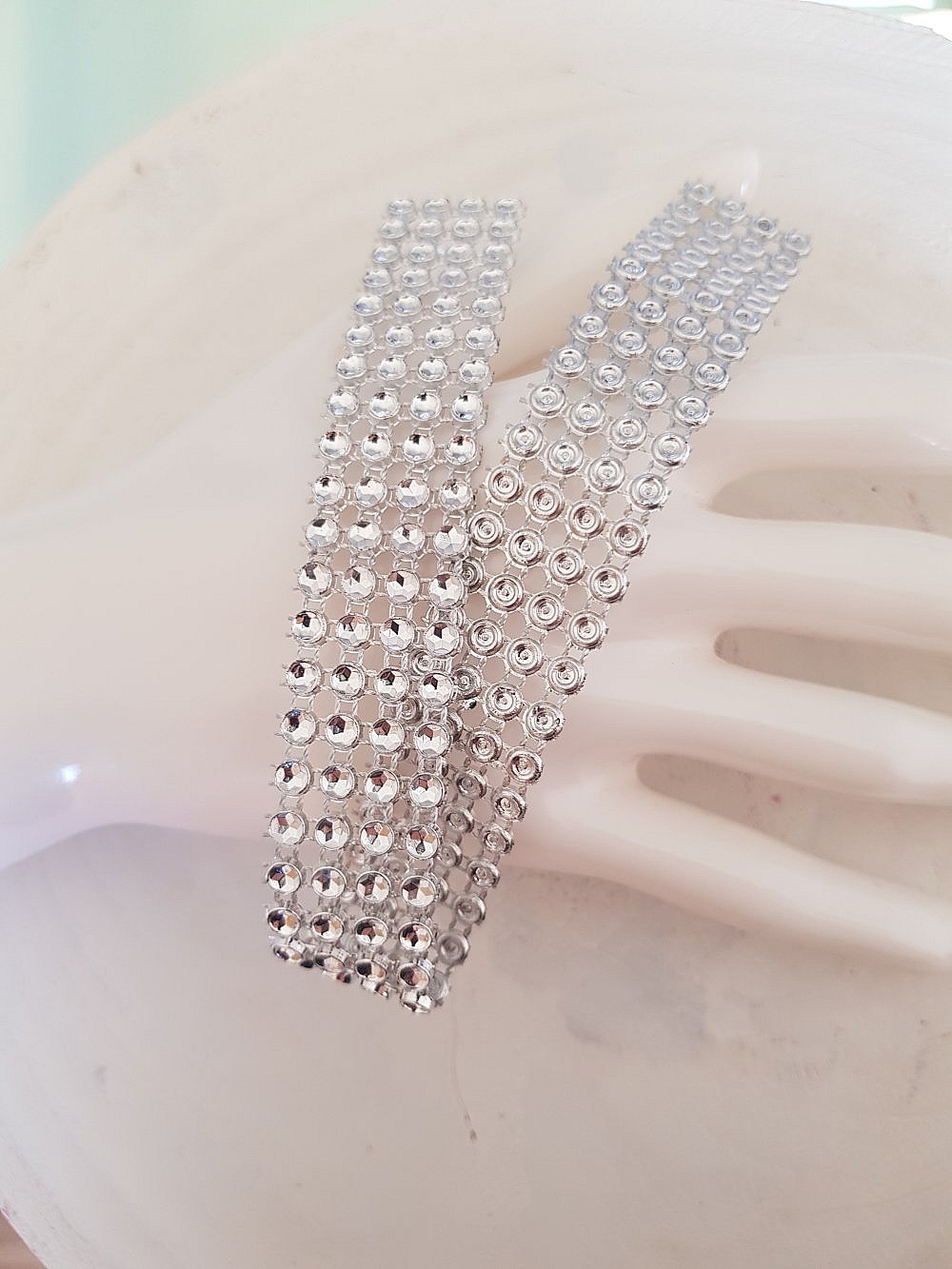 S&oslash;lv Strassb&aring;nd per 0,22 cm per 2 stykker.