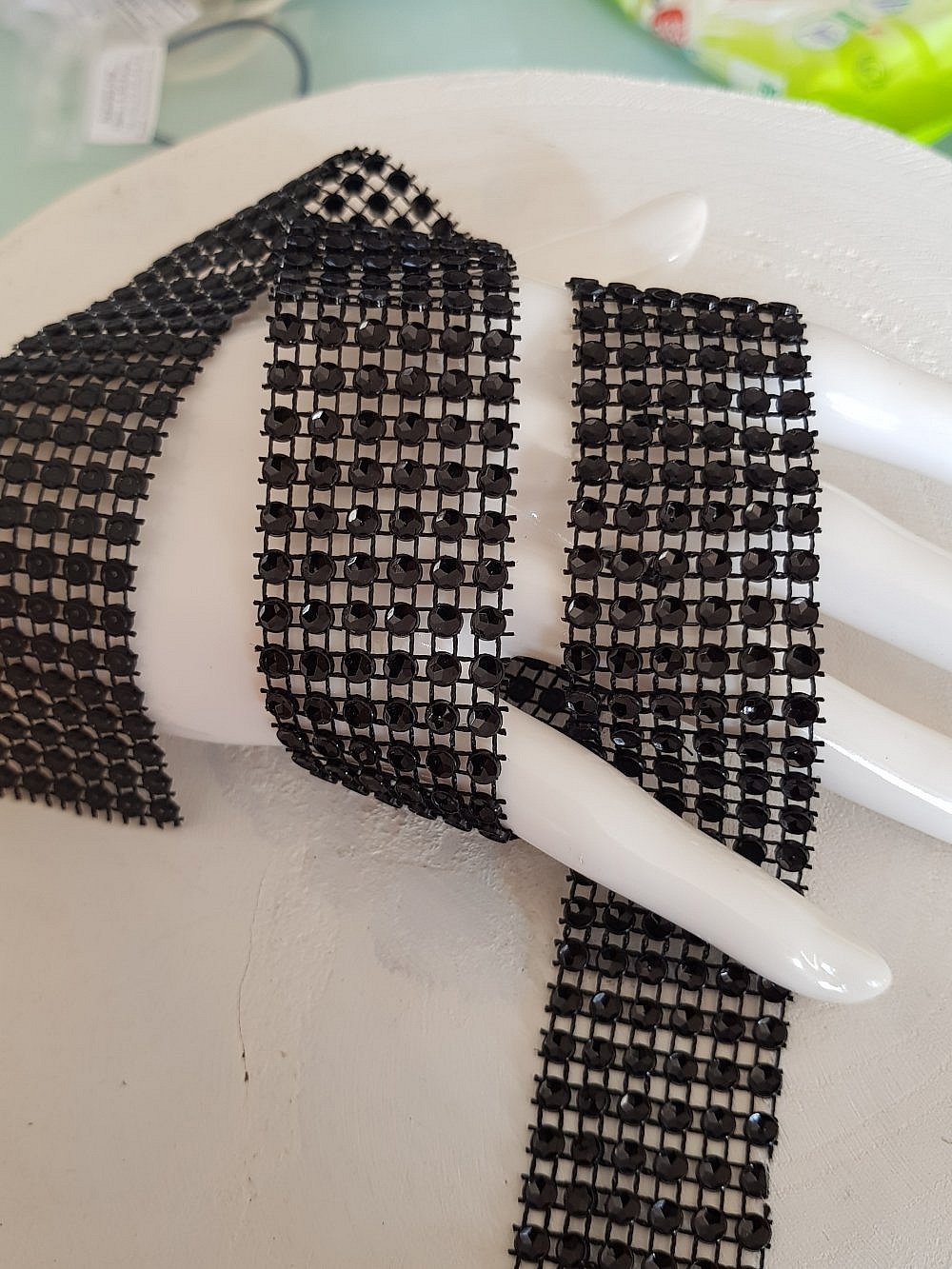 Strassb&aring;nd svart per 0,50 cm.