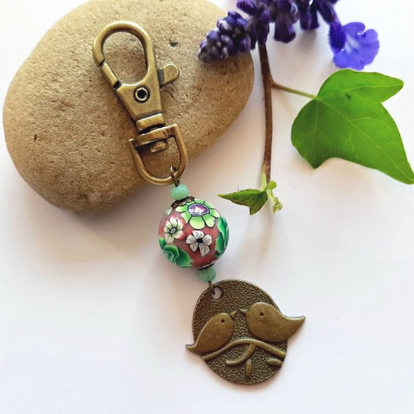 n&oslash;kkelring medalje duo av fugler bronse farge og perle utformet blomstermotiv gr&oslash;nn og vin leesmulticolour