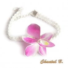 Orkidéarmbånd som kan tilpasses et hvitt hårbånd av guipureblonder og dets rosa silke orkidébryllupsblomst