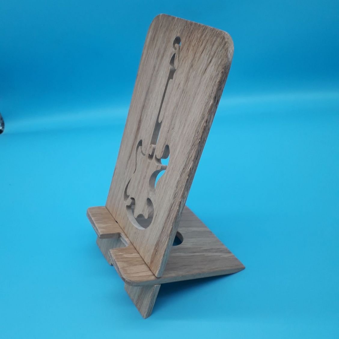 Vertikal mobiltelefonholder med gitarmotiv