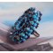 Naïade ring brodert med en turkisblå harpiks og krystall cabochon, et vakkert lysspill.