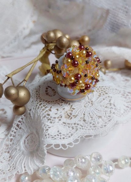 Solskinnsring med fasetter, perleperler og Swarovski-krystallspinnere