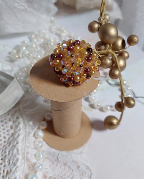 Solskinnsring med fasetter, perleperler og Swarovski-krystallspinnere