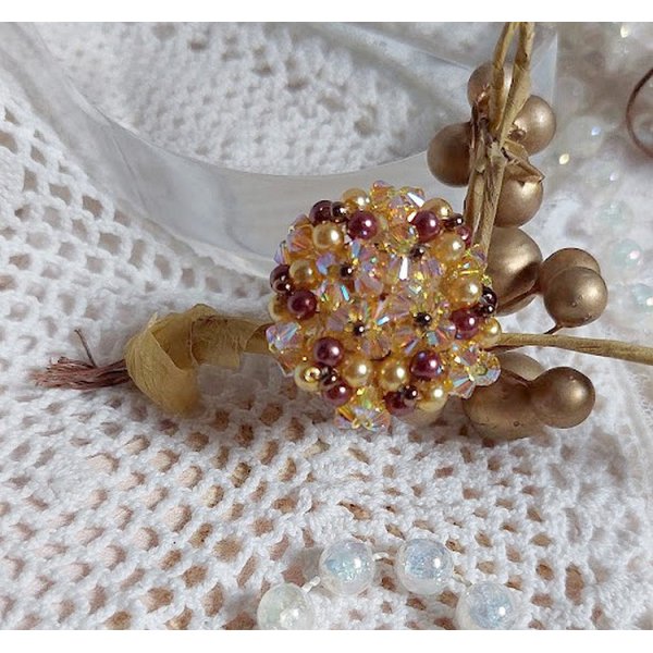 Solskinnsring med fasetter, perleperler og Swarovski-krystallspinnere