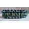 Glitrende Aurora-armbånd med svarte fasetter og fargede snurretopper i Swarovski-krystall
