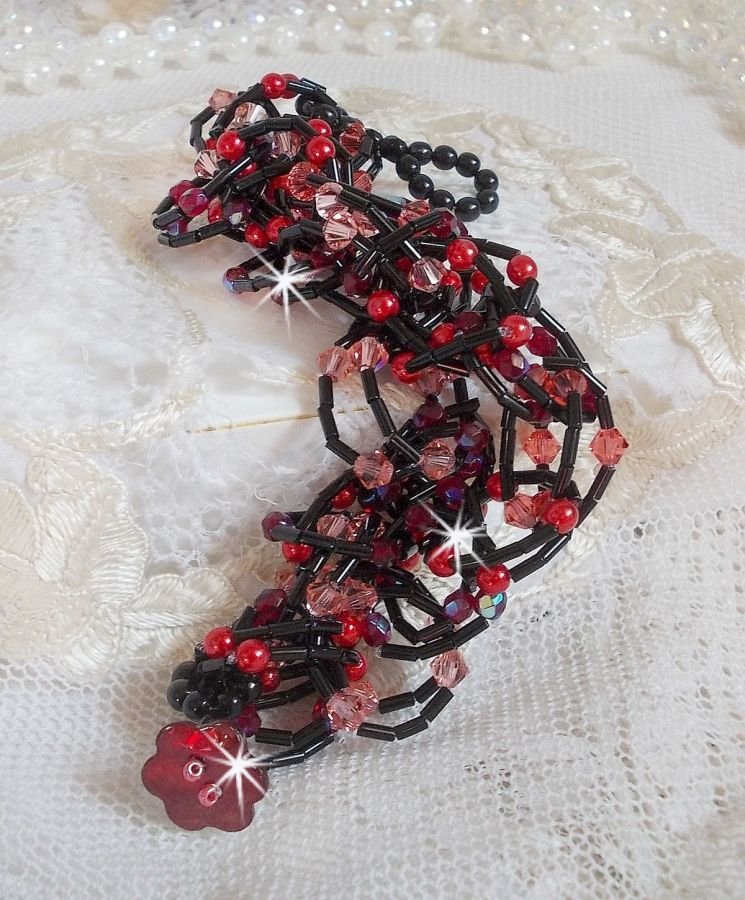 Følelsesarmbånd med rørperler, perlemorperler og snurretopper av Swarovski-krystall