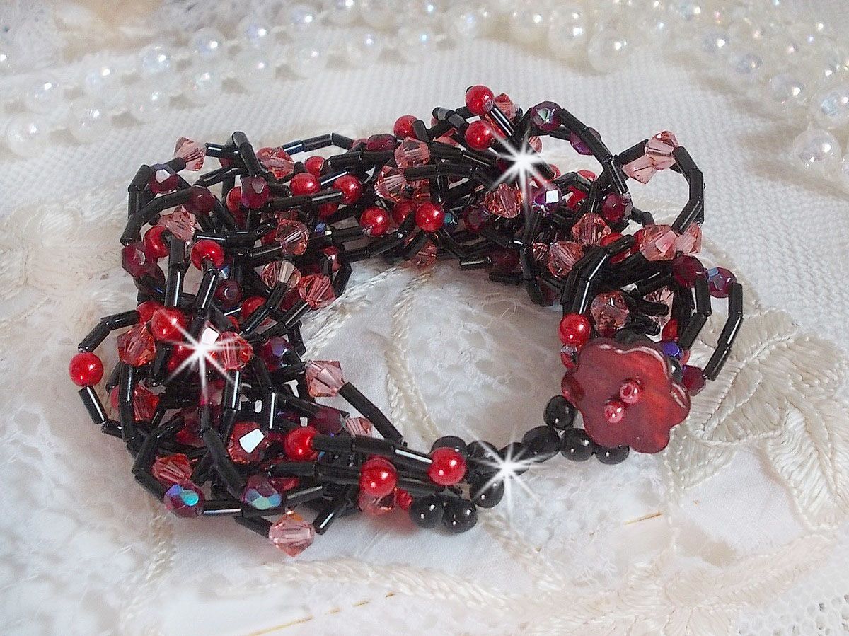 Følelsesarmbånd med rørperler, perlemorperler og snurretopper av Swarovski-krystall